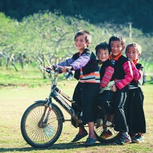 Local children smiling in a Vietnamese village