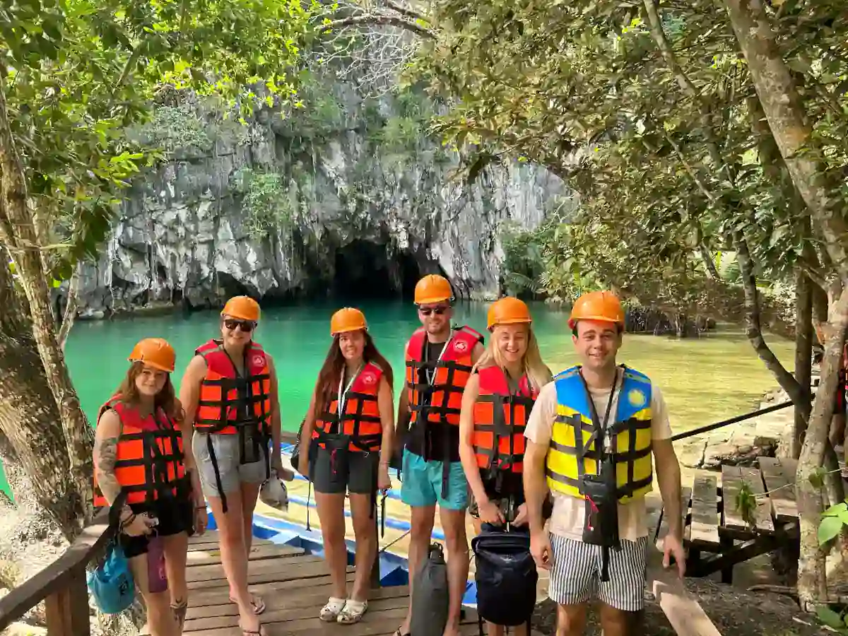 Travellers in helmets and life jackets at the entrance to the Puerto Princesa Underground River