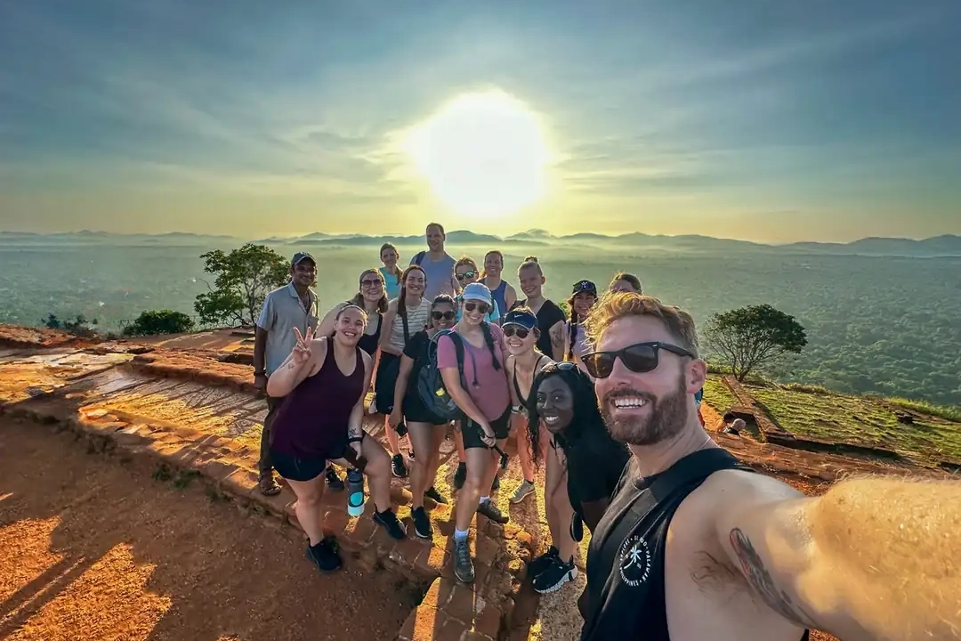 sunrise-sigiriya-summit-group One Life Adventures group on the summit of Sigiriya Rock at sunrise